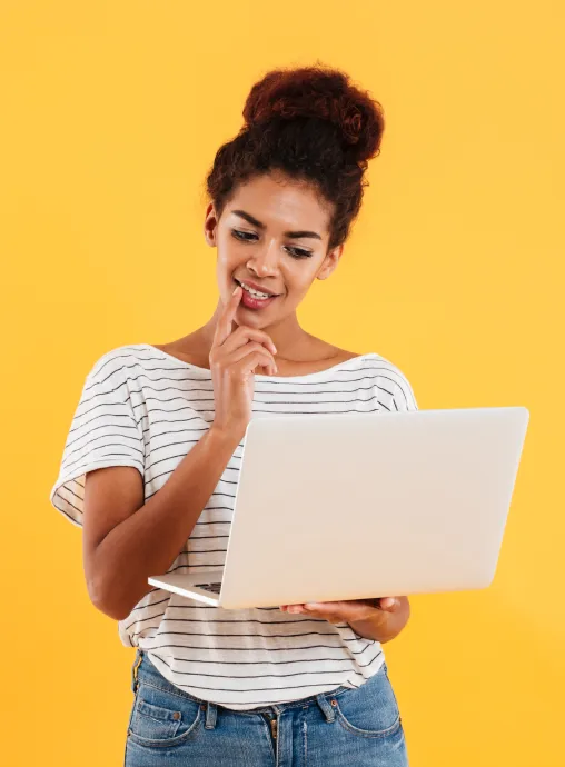 young-positive-cool-lady-with-curly-hair-using-laptop-isolated
